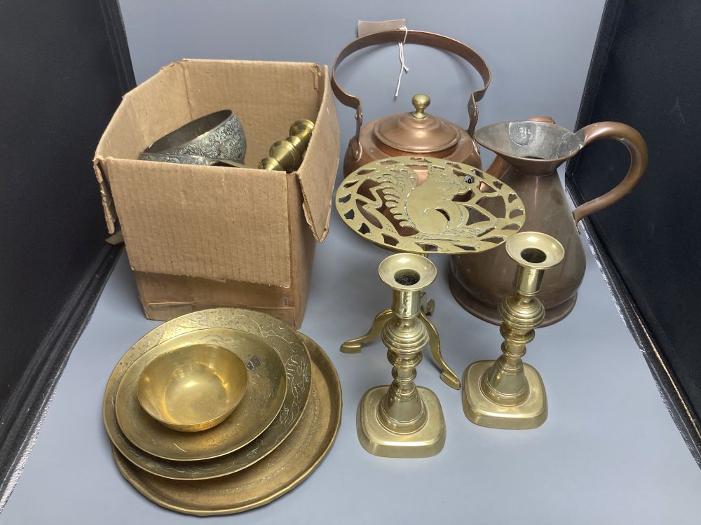 Miscellaneous metalware, including a copper kettle, two pairs of brass candlesticks, a squirrel trivet, tobacco box, etc.